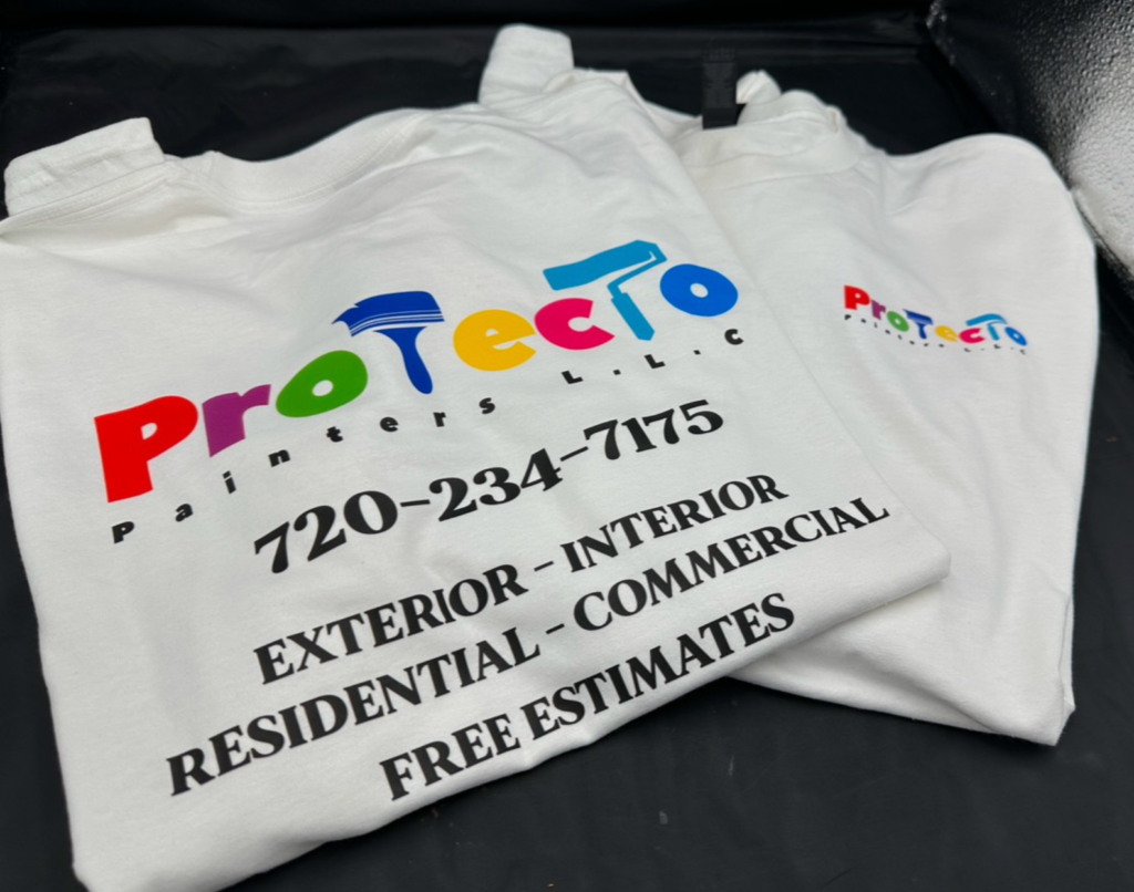 Custom printed white t-shirts with a painting company logo and phone number, made by ASD Printing